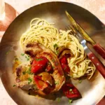 Pork Chops with Cherry Pepper Sauce Over Spaghetti